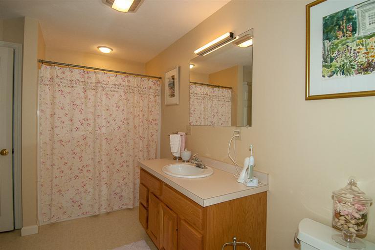 481 Buck Island Road, Unit 15D West Yarmouth, MA 02673 - Photo 17 of 21 a bathroom with a sink a mirror and a toilet