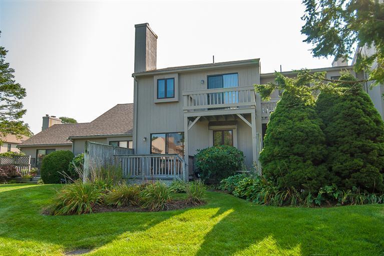 481 Buck Island Road, Unit 15D West Yarmouth, MA 02673 - Photo 4 of 21 a front view of a house with garden