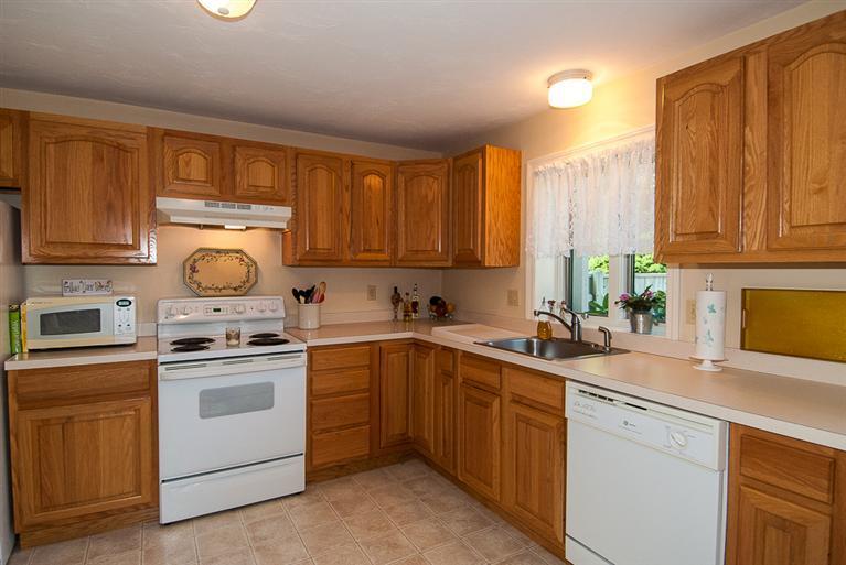 481 Buck Island Road, Unit 15D West Yarmouth, MA 02673 - Photo 5 of 21 a kitchen with a sink stove and cabinets