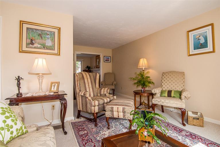 481 Buck Island Road, Unit 15D West Yarmouth, MA 02673 - Photo 10 of 21 a living room with furniture and a table