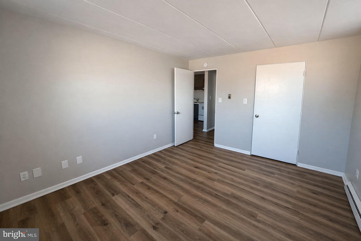 403 North Newberry Street, Unit 303 York, PA 17401 - Photo 8 of 11 a view of an empty room with wooden floor