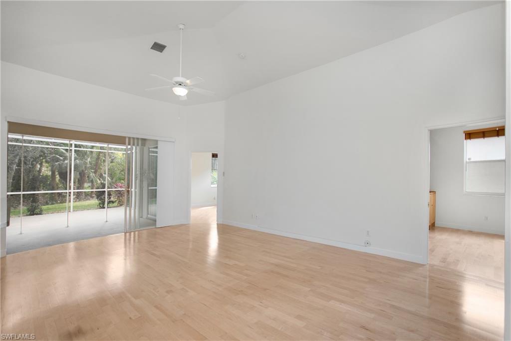 20951 Rivers Ford Estero, FL 33928 - Photo 11 of 49 an empty room with wooden floor and windows