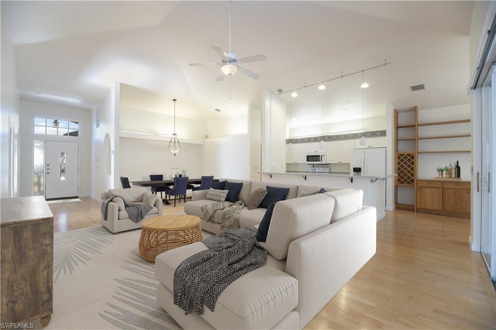 20951 Rivers Ford Estero, FL 33928 - Photo 14 of 49 a living room with furniture and a view of kitchen