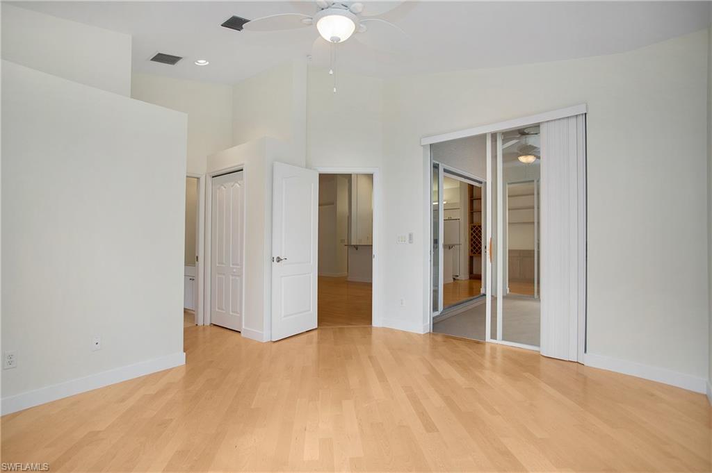 20951 Rivers Ford Estero, FL 33928 - Photo 30 of 49 an empty room with closet and wooden floor