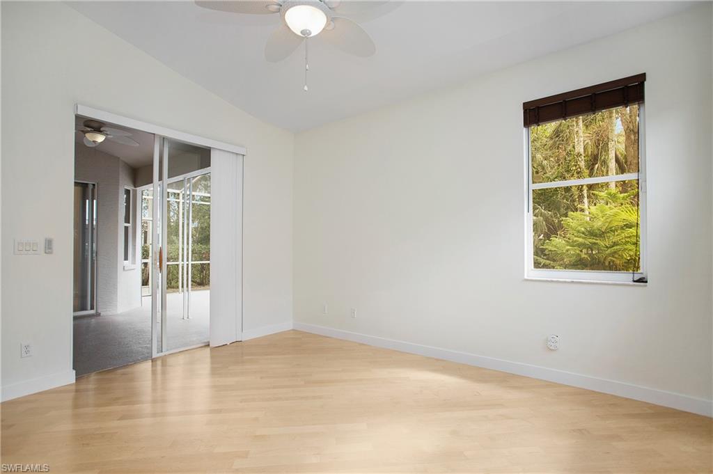 20951 Rivers Ford Estero, FL 33928 - Photo 33 of 49 an empty room with wooden floor and windows