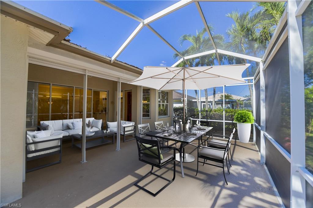 20951 Rivers Ford Estero, FL 33928 - Photo 40 of 49 a patio with patio table and chairs