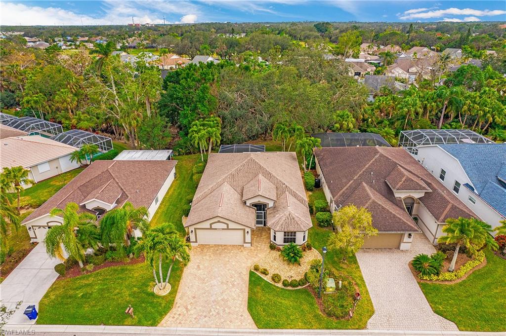 20951 Rivers Ford Estero, FL 33928 - Photo 4 of 49 an aerial view of a house with garden space and a lake view