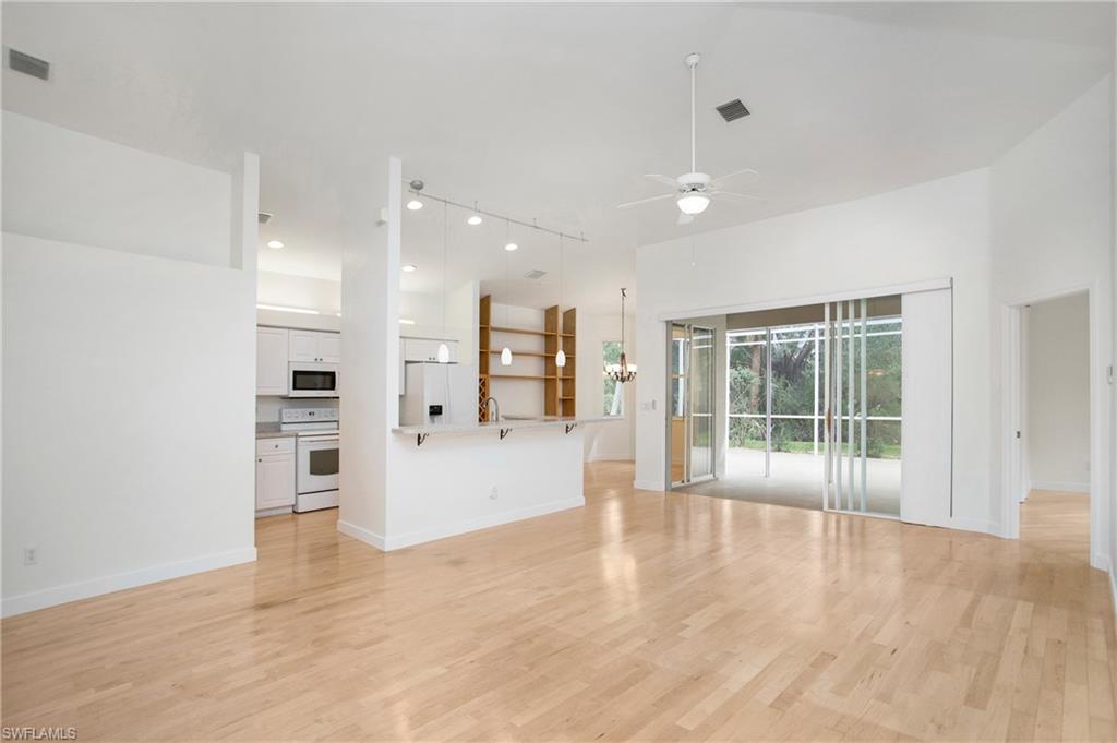 20951 Rivers Ford Estero, FL 33928 - Photo 9 of 49 a view of an empty room with a kitchen