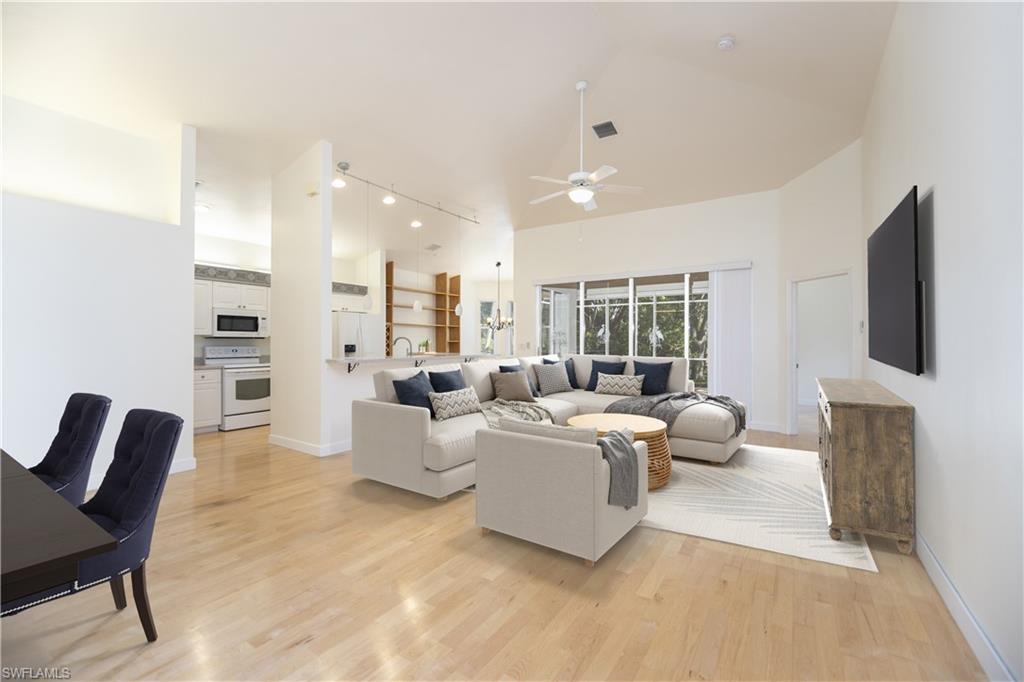 20951 Rivers Ford Estero, FL 33928 - Photo 10 of 49 a living room with furniture flat screen tv and a fireplace