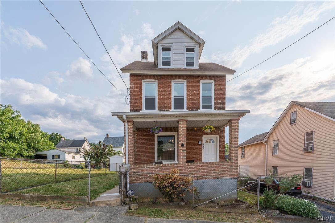 Three story detached brick home