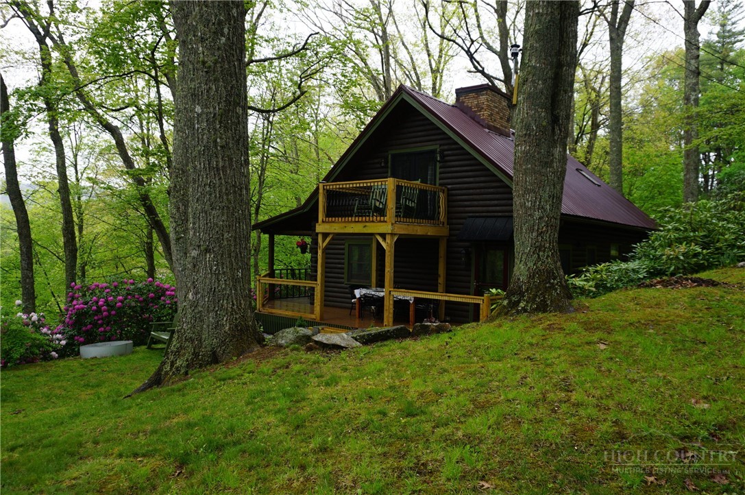 557 White Pine Road Newland, NC 28657 - Photo 33 of 41 a view of an house with backyard space and garden