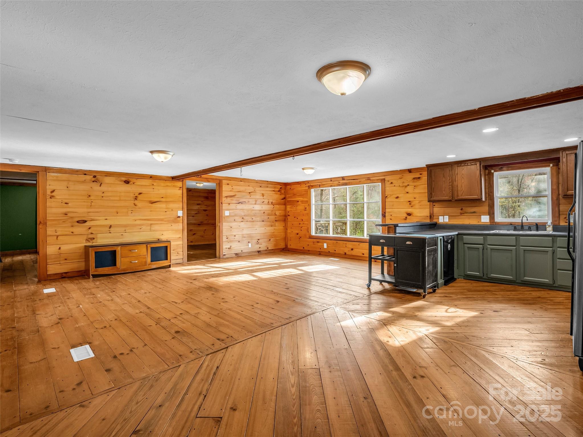 3620 Howard Gap Road Saluda, NC 28773 - Photo 18 of 35 a view of a kitchen with a sink and microwave