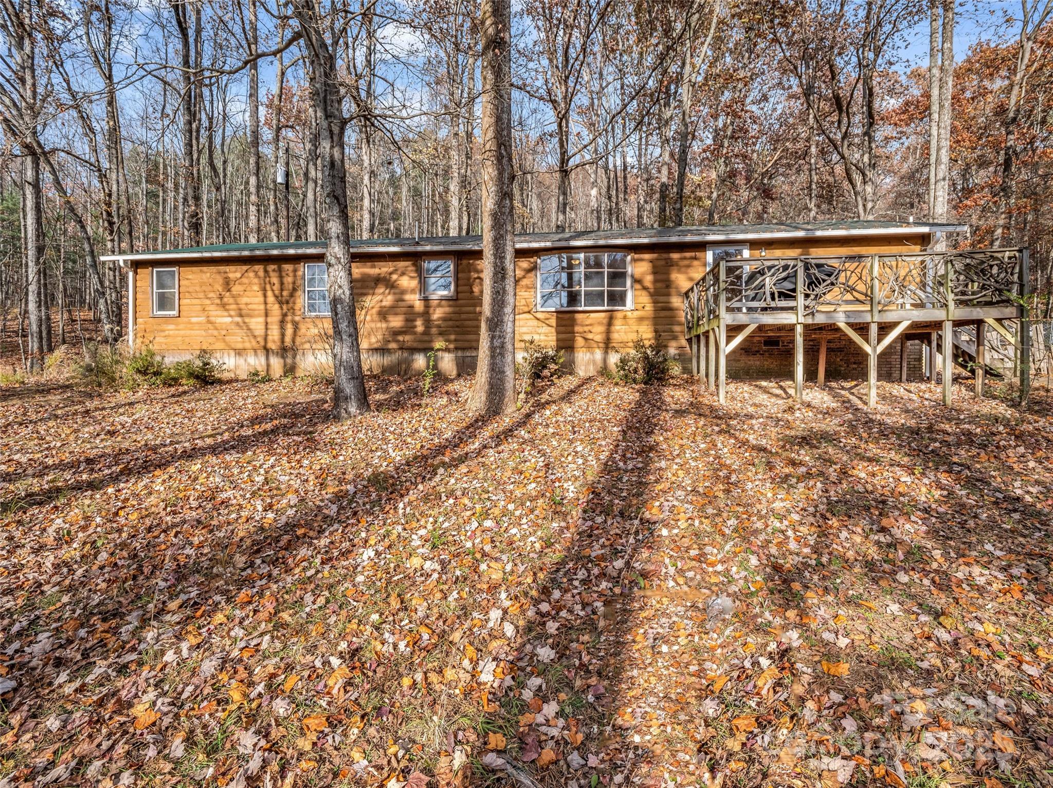 3620 Howard Gap Road Saluda, NC 28773 - Photo 2 of 35 a view of a yard with wooden fence