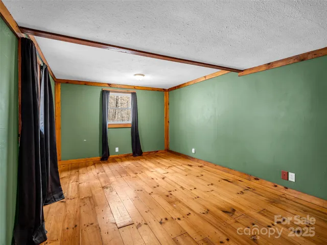 a view of a big room with windows and cabinet