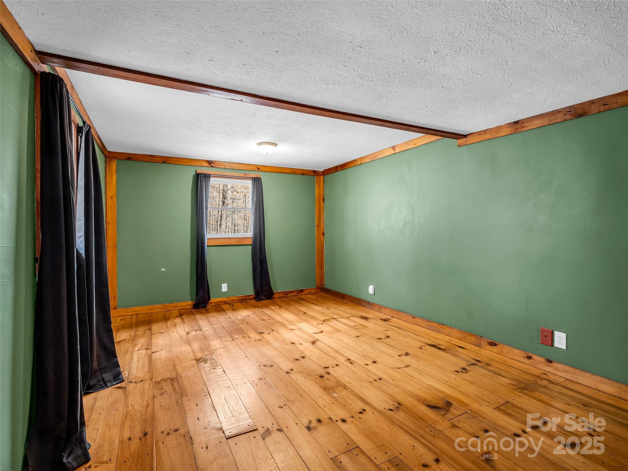 3620 Howard Gap Road Saluda, NC 28773 - Photo 23 of 35 a view of a big room with windows and cabinet