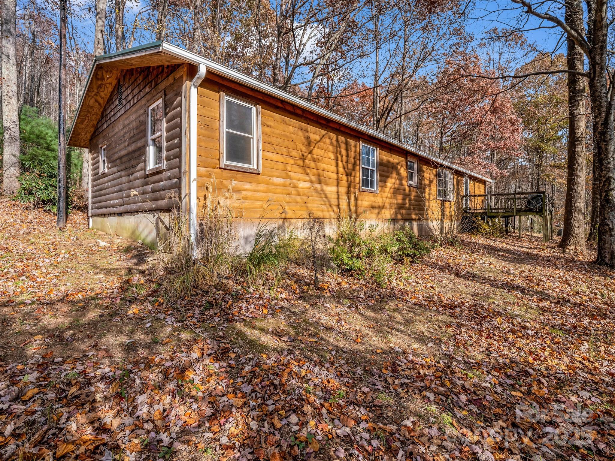 3620 Howard Gap Road Saluda, NC 28773 - Photo 4 of 35 a backyard of a house with lots of green space