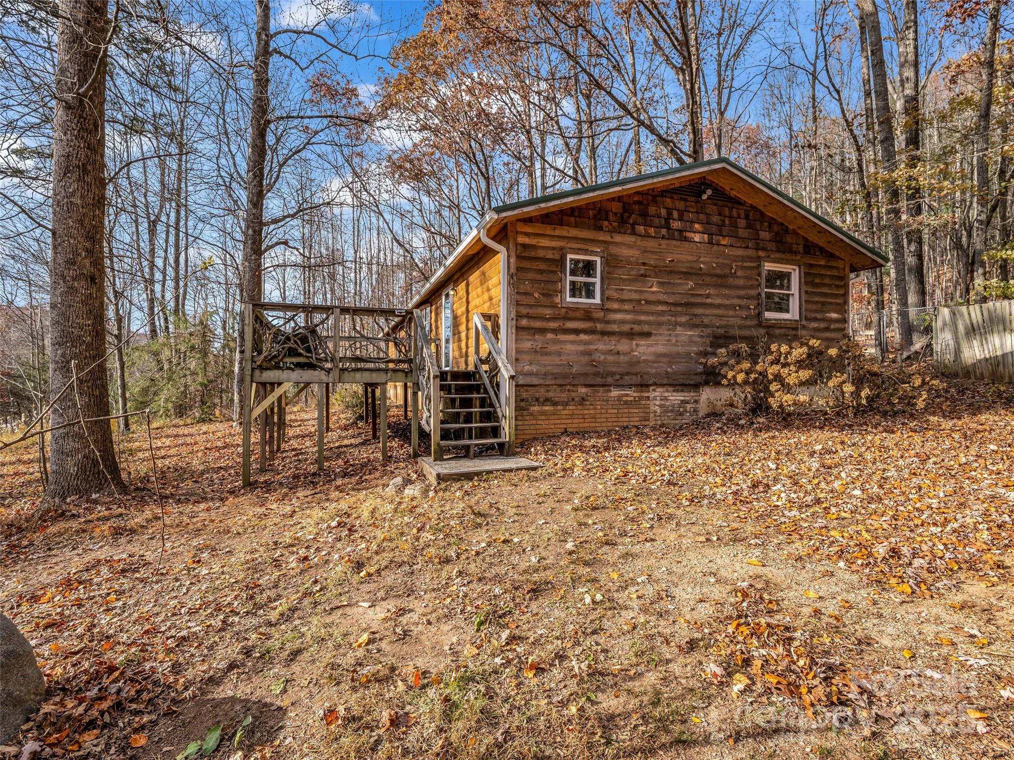 3620 Howard Gap Road Saluda, NC 28773 - Photo 5 of 35 a front view of a house with garden