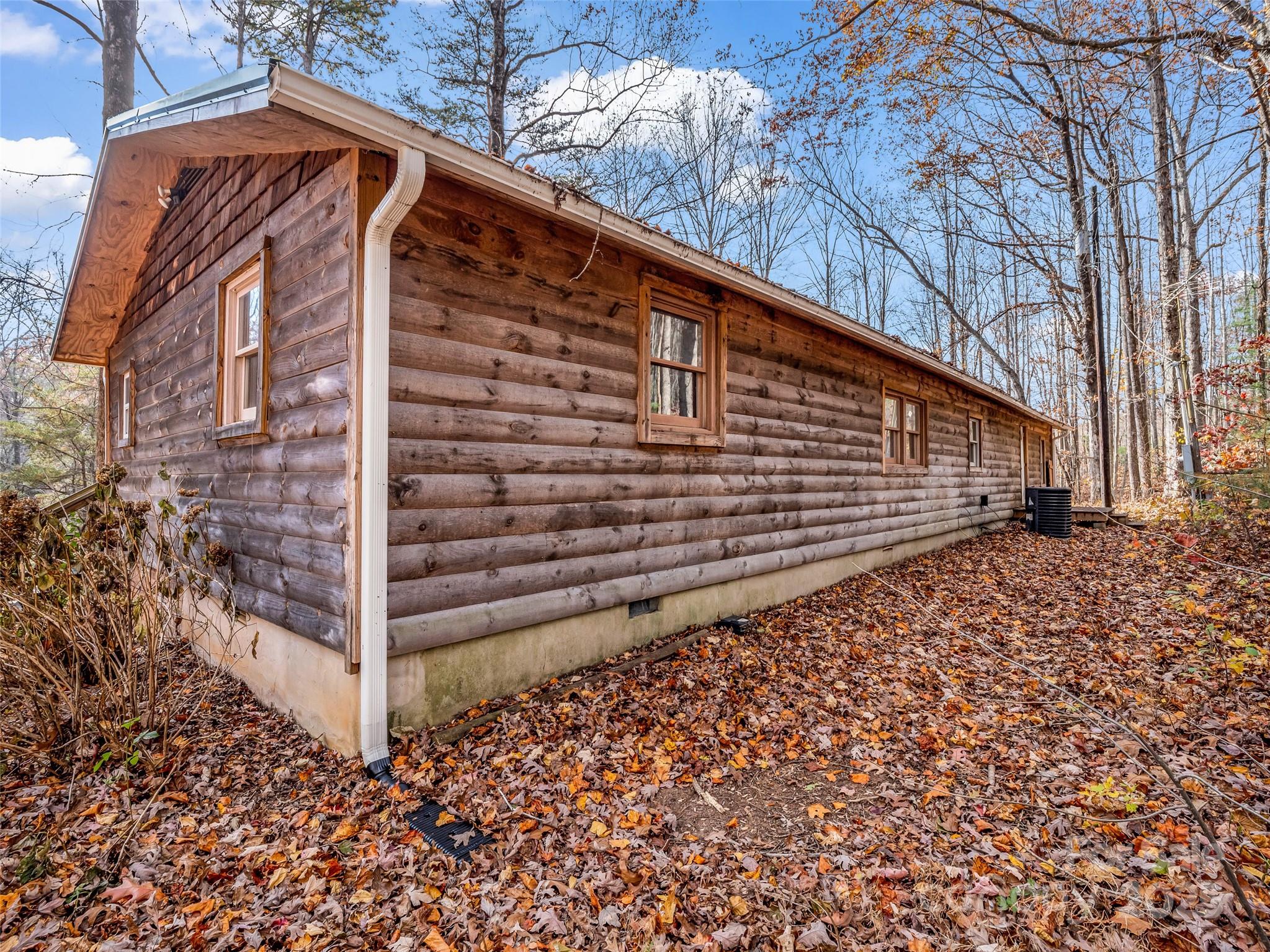 3620 Howard Gap Road Saluda, NC 28773 - Photo 6 of 35 a backyard of a house with a street
