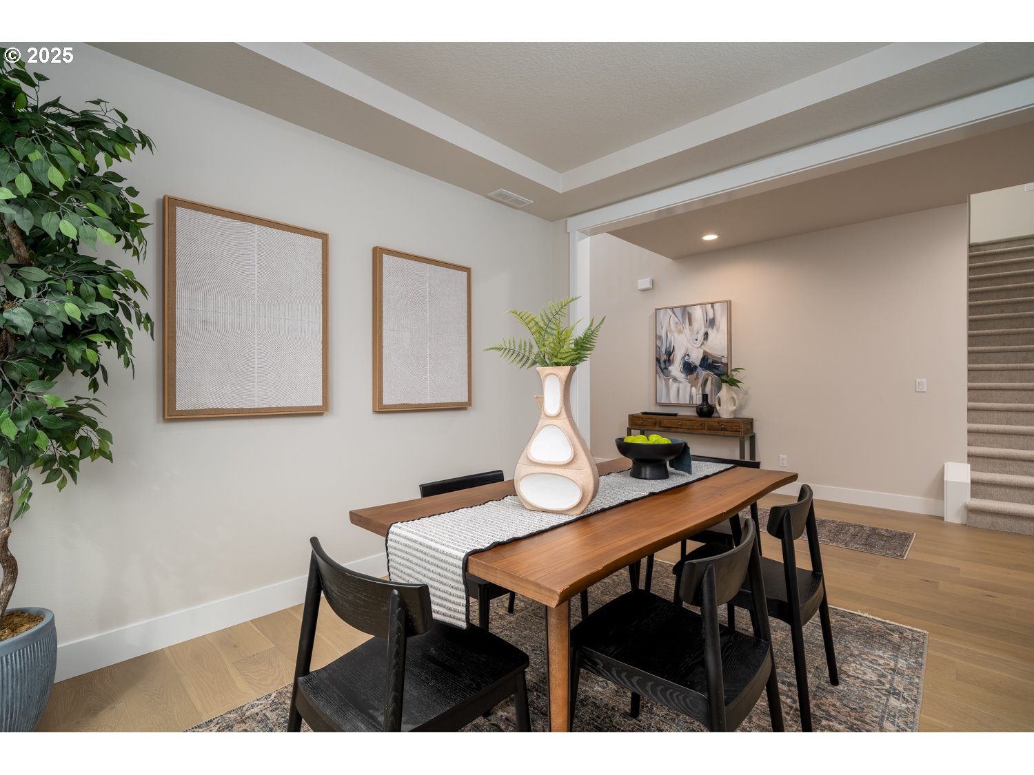 1392 North Kalani Loop, Unit LOT 57 Ridgefield, WA 98642 - Photo 11 of 47 a view of a dining room with furniture and wooden floor