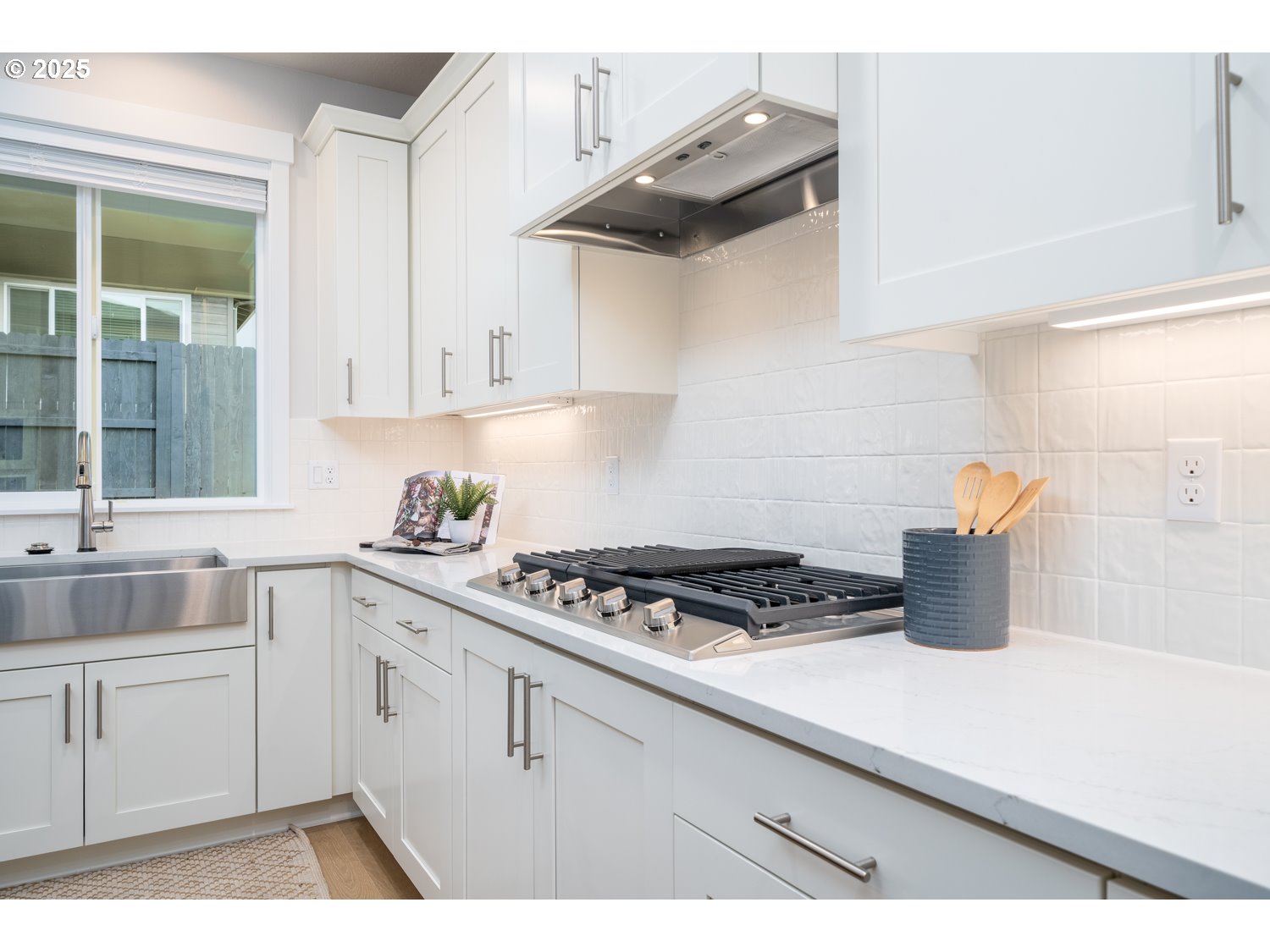 1392 North Kalani Loop, Unit LOT 57 Ridgefield, WA 98642 - Photo 13 of 47 a kitchen with cabinets a stove and a sink