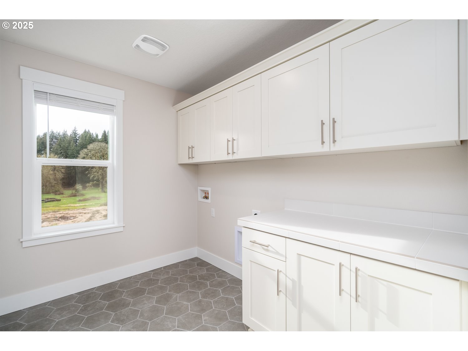 1392 North Kalani Loop, Unit LOT 57 Ridgefield, WA 98642 - Photo 38 of 47 a kitchen with appliances cabinets and a window