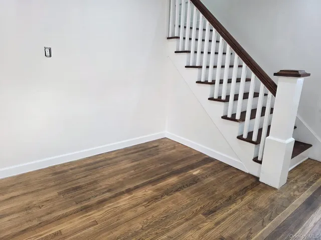 a view of entryway with wooden floor