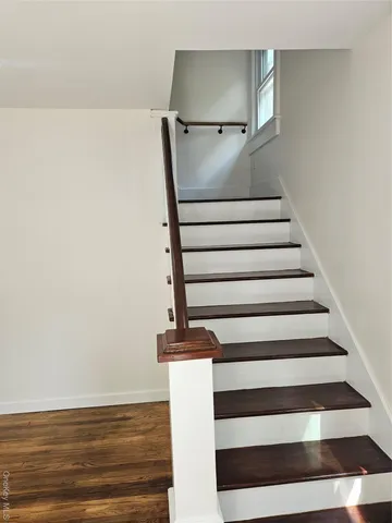 a view of entryway with wooden floor