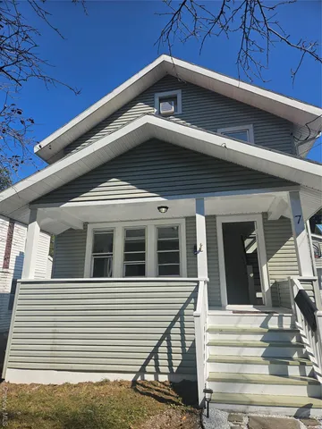 a view of a house with large windows