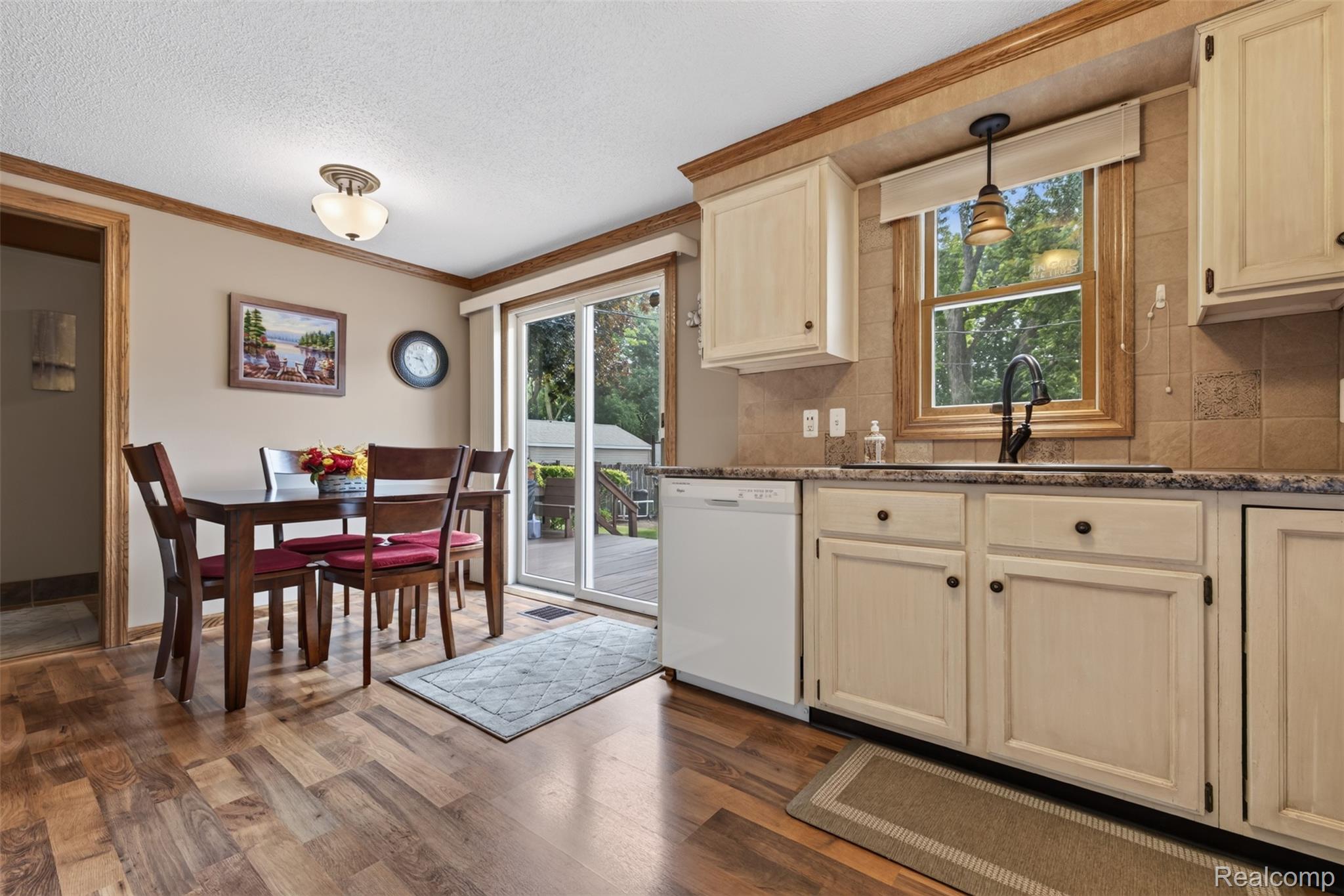 5977 Anglers Road Ortonville, MI 48462 - Photo 11 of 63 Kitchen and dining area featuring wood-finish flooring