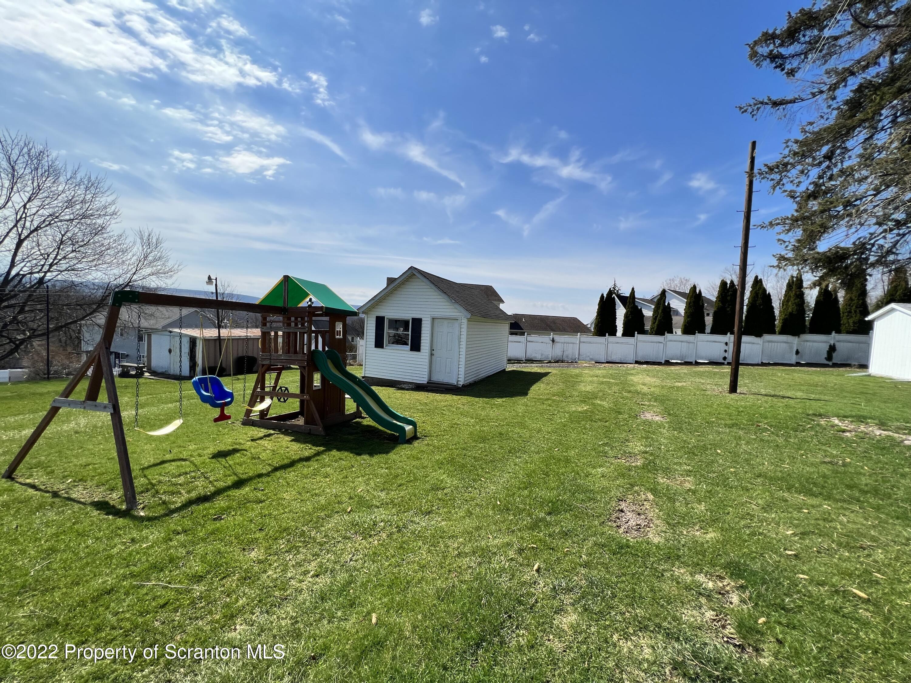 897 Scott Road Dickson City, PA 18519 - Photo 17 of 18 a view of a house with backyard and sitting area