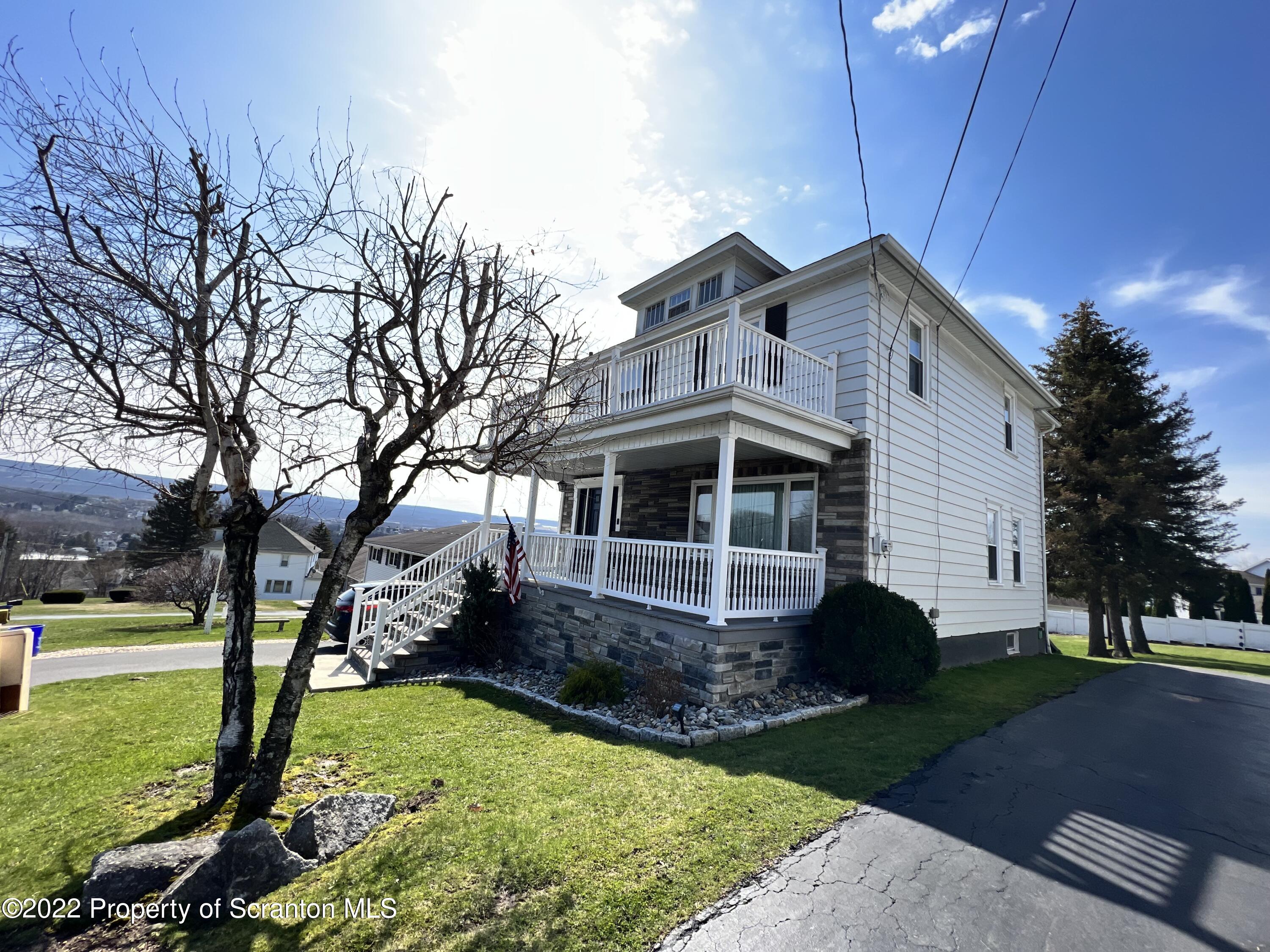 897 Scott Road Dickson City, PA 18519 - Photo 3 of 18 a front view of a house with garden