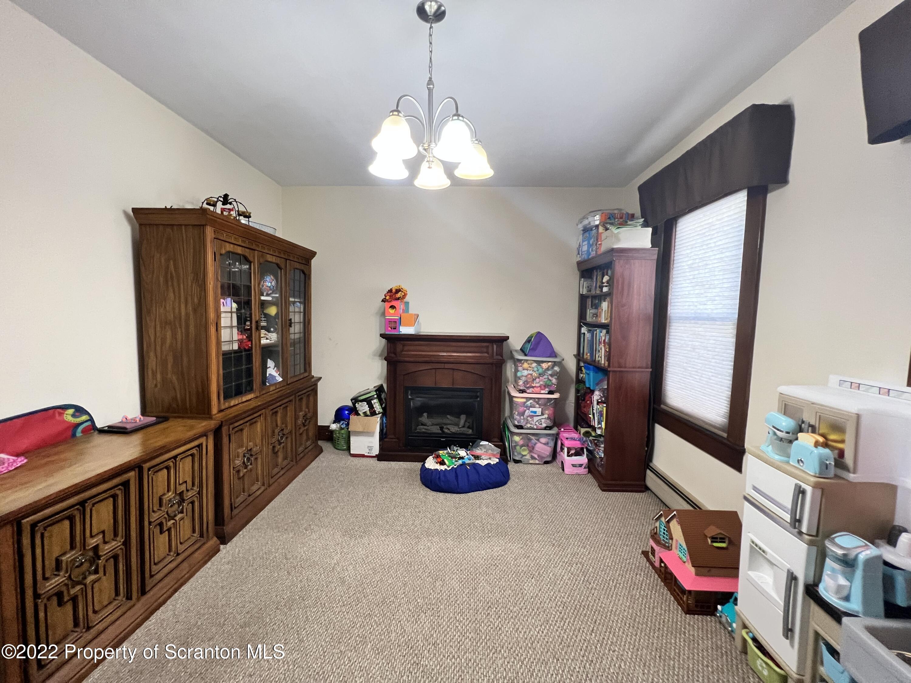 897 Scott Road Dickson City, PA 18519 - Photo 5 of 18 a living room with lots of furniture and a flat screen tv