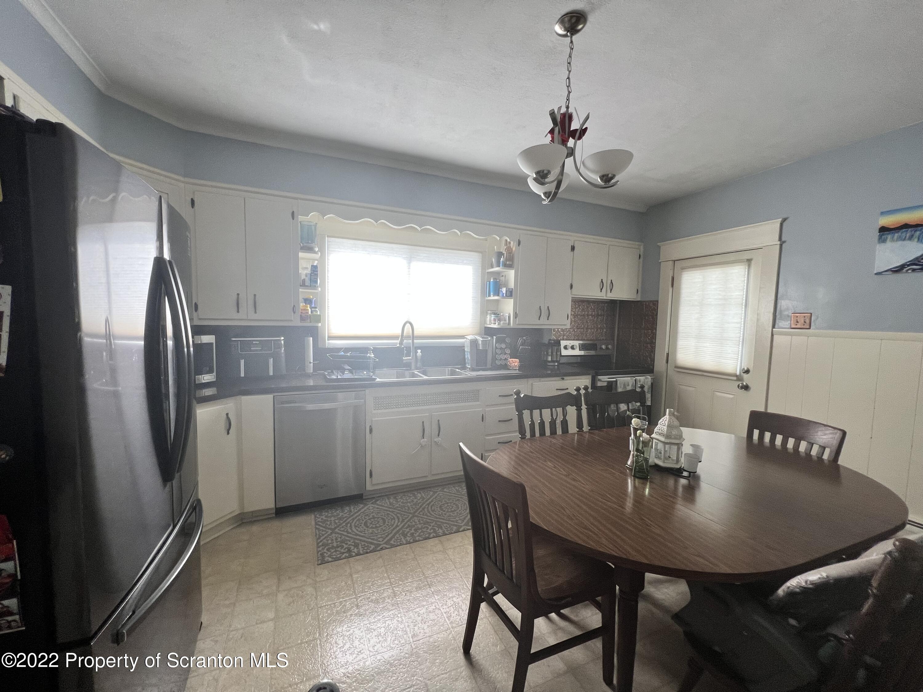 897 Scott Road Dickson City, PA 18519 - Photo 7 of 18 a view of a dining room with furniture window and wooden floor