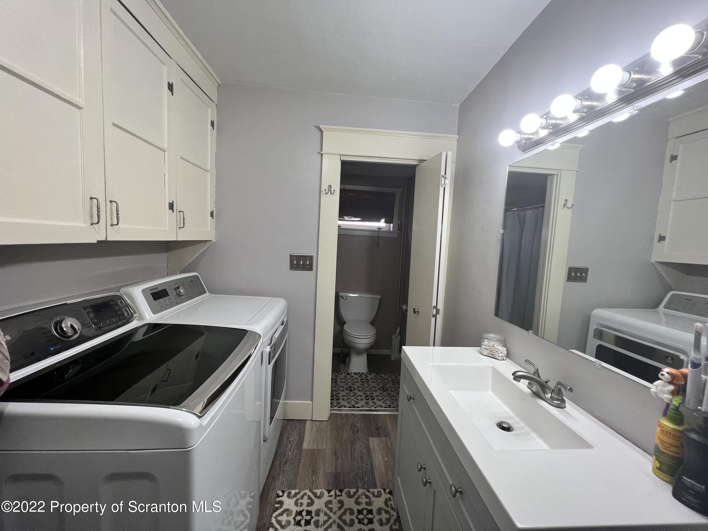 897 Scott Road Dickson City, PA 18519 - Photo 8 of 18 a kitchen that has a sink and a stove