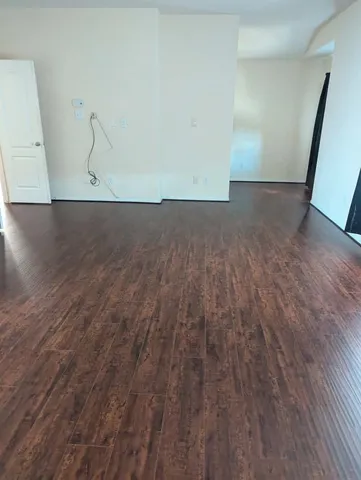 a view of room with wooden floor and floors