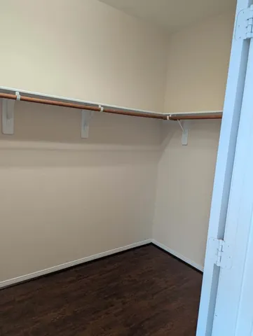 a view of an empty walk in closet