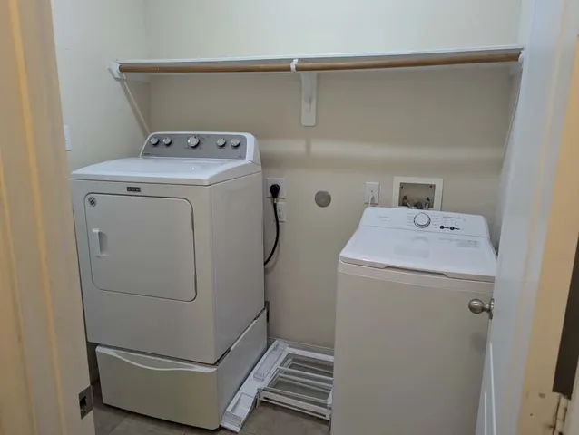 a utility room with dryer and washer
