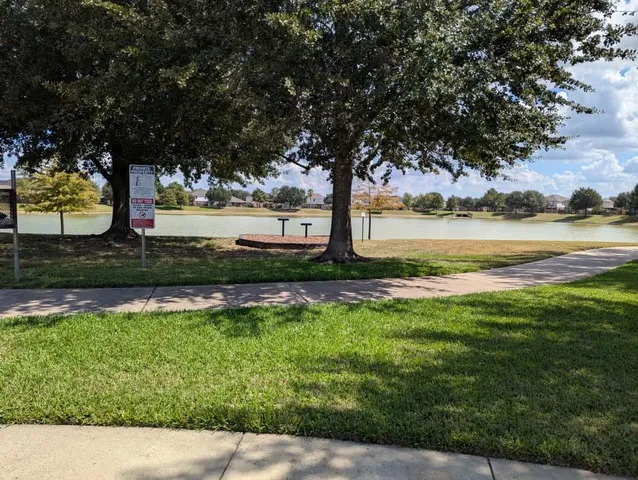 a view of lake with a yard