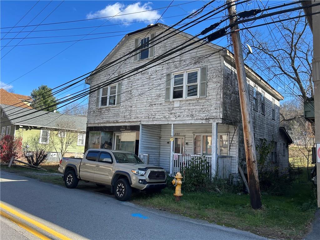 a car parked in front of a house