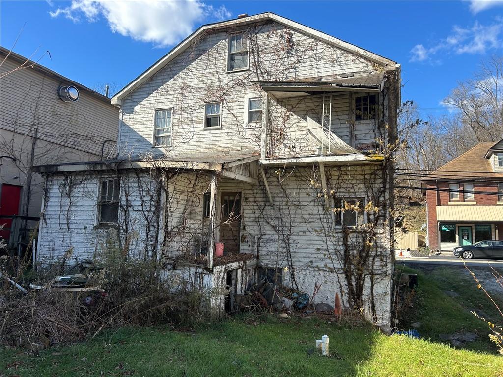 3127 Millers Run Road Cecil, PA 15321 - Photo 3 of 14 a front view of a house with garden