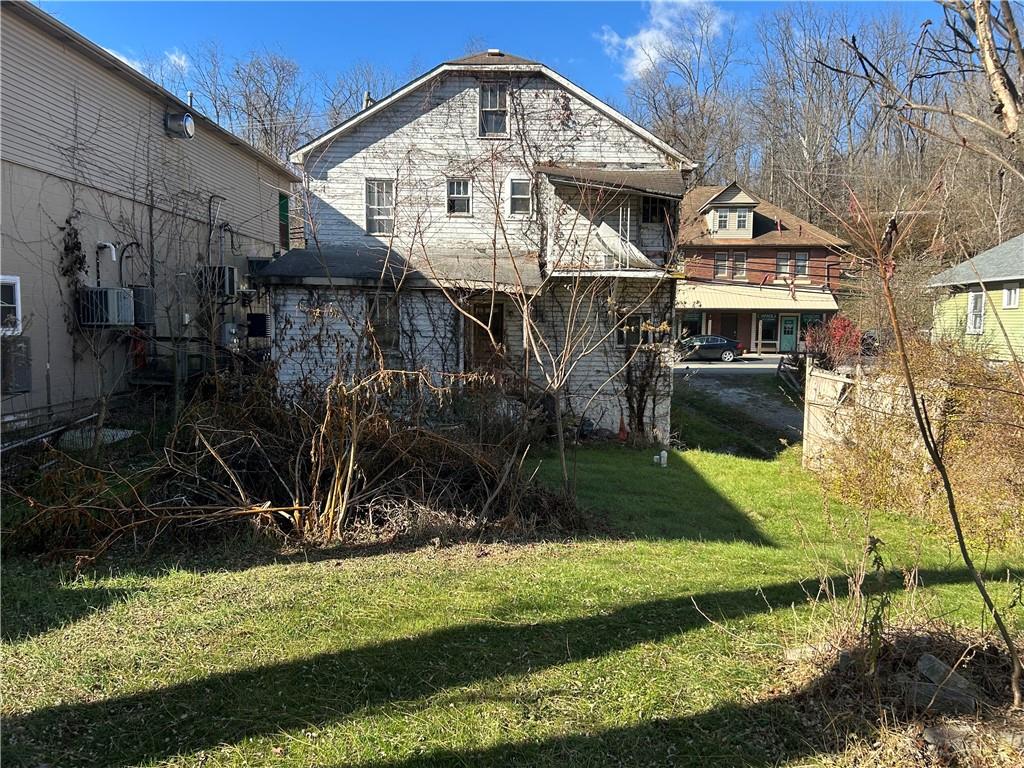 3127 Millers Run Road Cecil, PA 15321 - Photo 4 of 14 a front view of a house with a yard