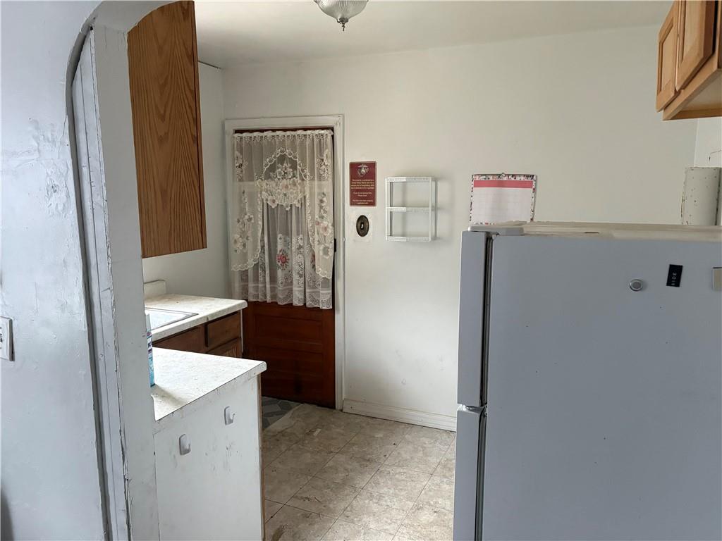 3127 Millers Run Road Cecil, PA 15321 - Photo 8 of 14 a kitchen with a refrigerator and a stove