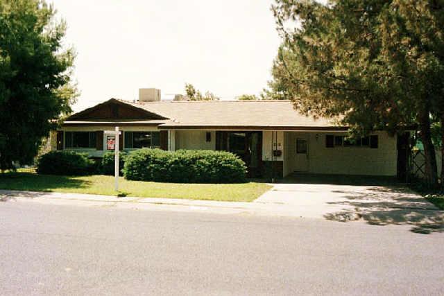 3225 West Wethersfield Road Phoenix, AZ 85029 - Photo 1 of 1 a front view of a house with a yard and garage