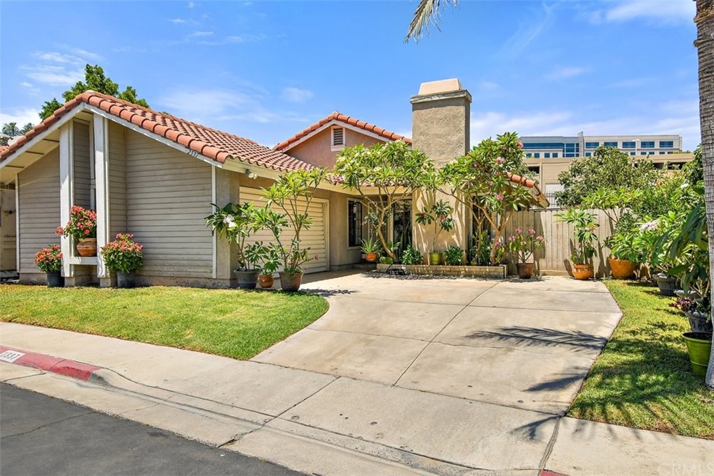 2337 Weatherwood Road Corona, CA 92879 - Photo 1 of 1 Front view with beautiful plumerias
