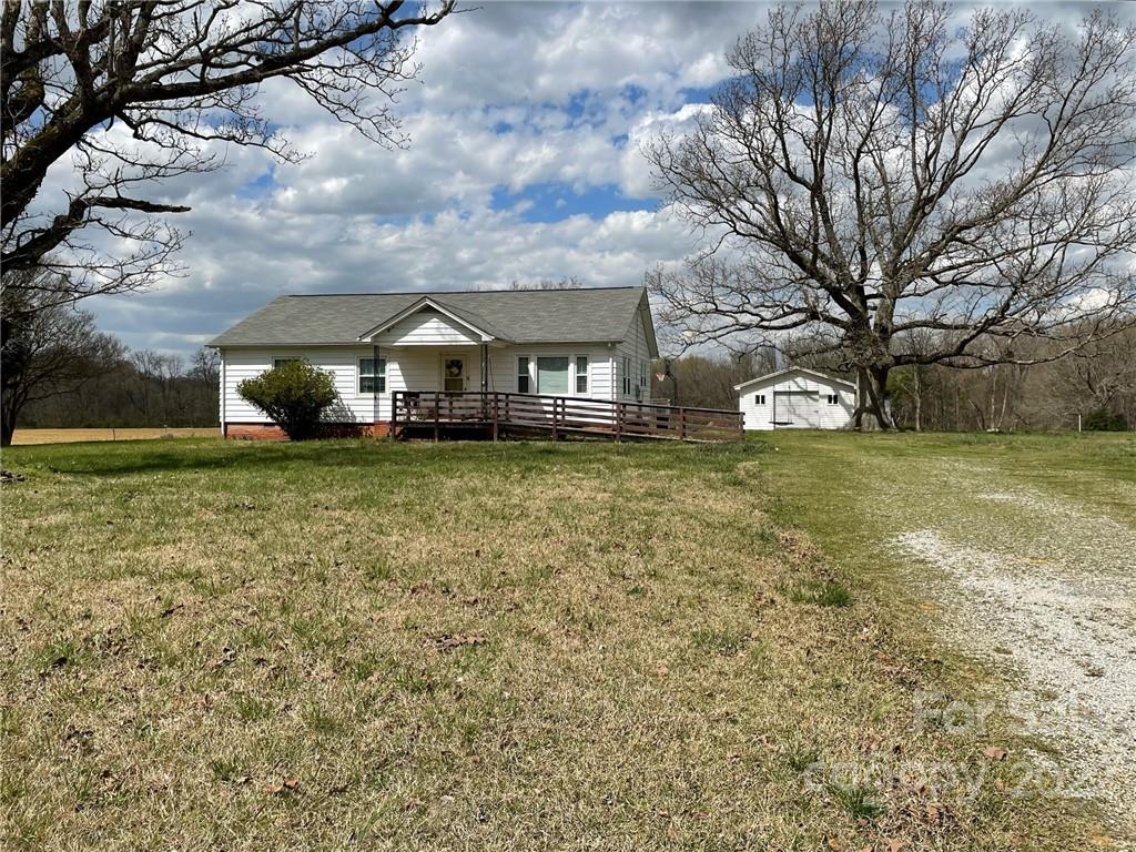 1406 Circle S Ranch Road Monroe, NC 28112 - Photo 1 of 3 a view of a yard with a house in the background