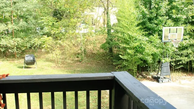 a view of balcony and yard