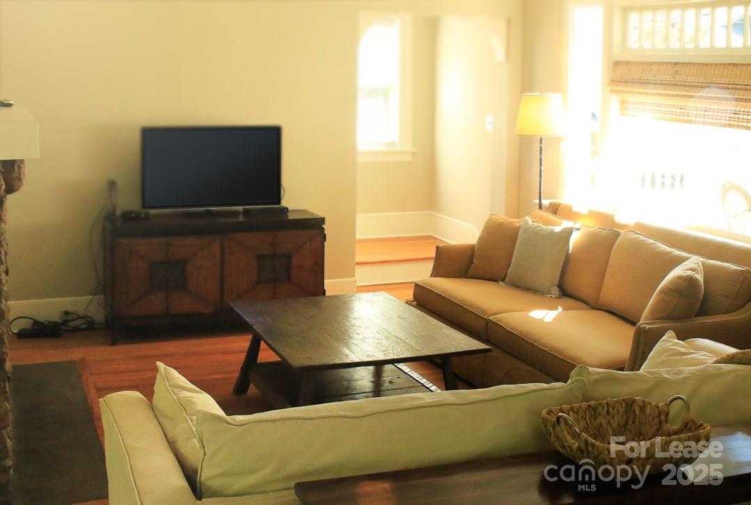 10 Coleman Avenue Asheville, NC 28801 - Photo 3 of 13 a living room with furniture and a flat screen tv