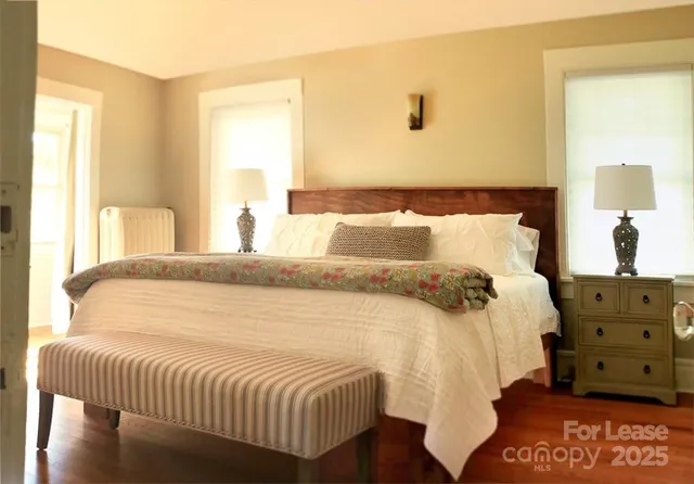 a bedroom with a bed and window