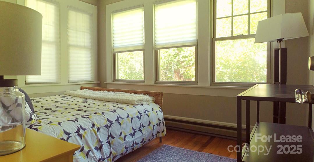 10 Coleman Avenue Asheville, NC 28801 - Photo 7 of 13 a bedroom with a bed and a window