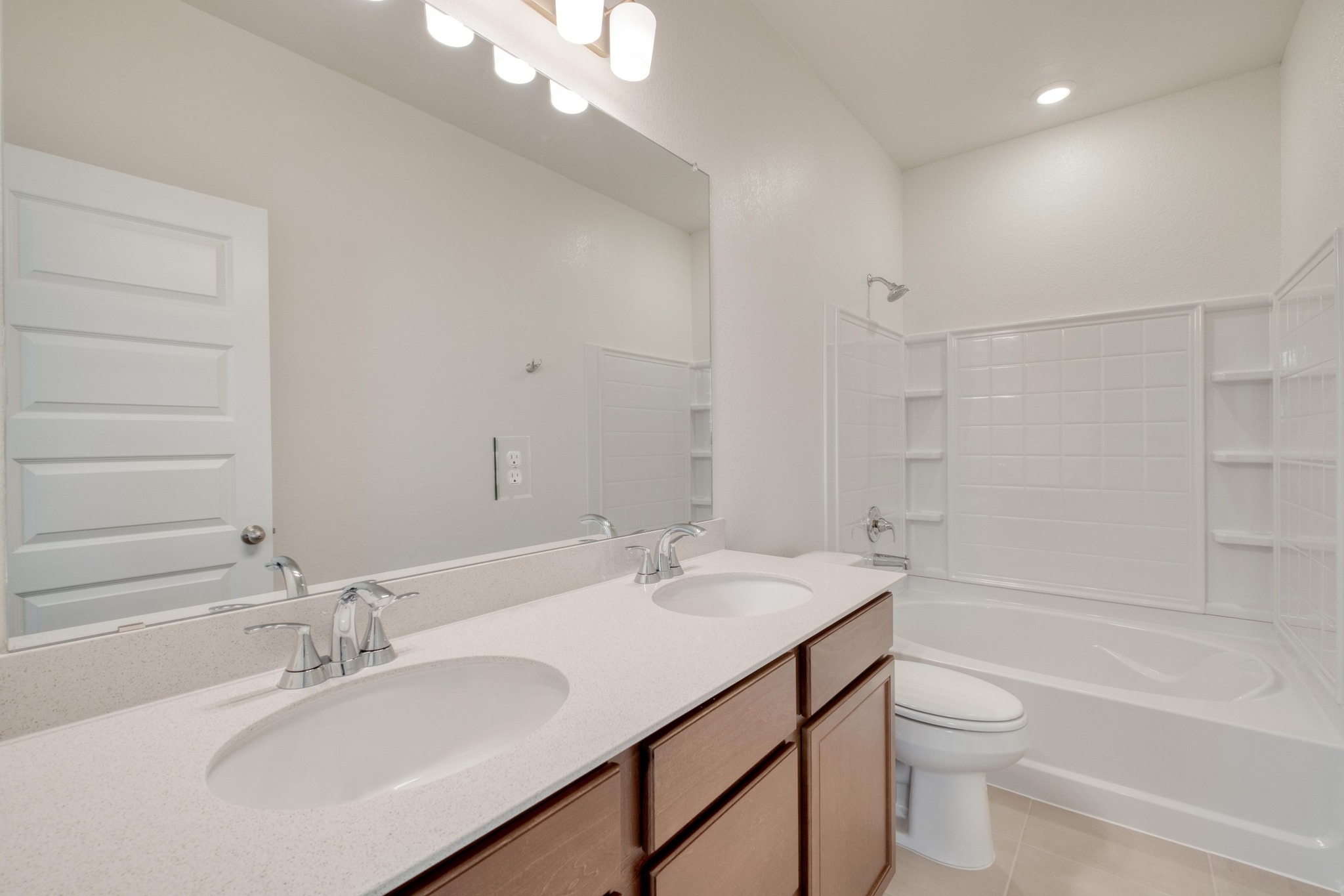 280 Feathers Street Jarrell, TX 76537 - Photo 20 of 28 a bathroom with a sink a toilet and shower